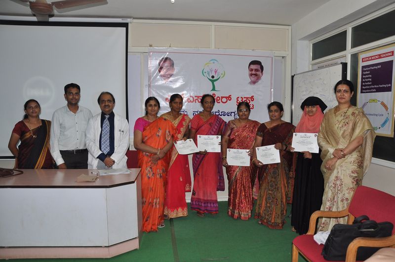 Trainees hold up their certificates after completing first aid and basic life support training.