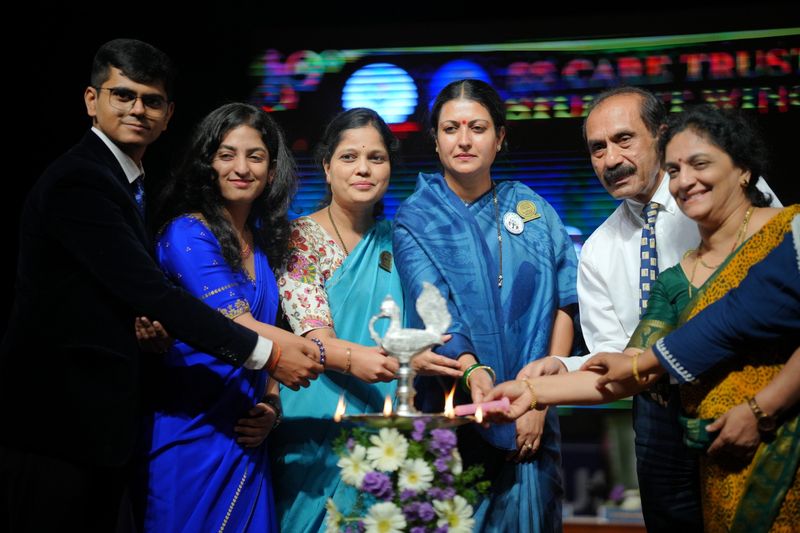 Students and faculty light a lamp on stage to launch the SSCT Student Wing.