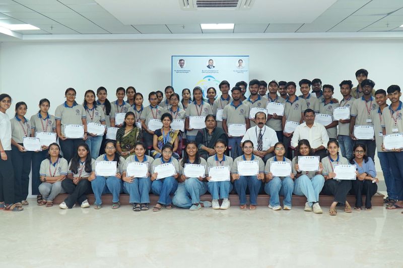 Group photo of first aid trainees holding completion certificates after a Jeeva Rakshana basic life support workshop.