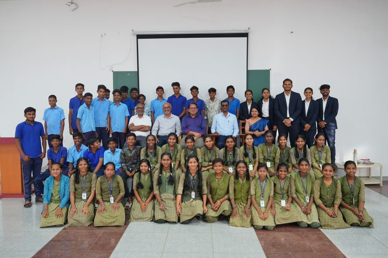 Large group photo of students and program staff posing together after a leadership workshop.