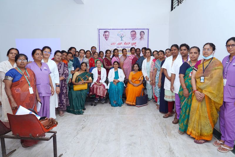 Staff and volunteers of SS Care Trust's women's health programme pose together for a group photo.