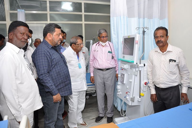 Officials viewing a haemodialysis machine in a patient care room at SS Care Trust's dialysis centre during a facility inspection.